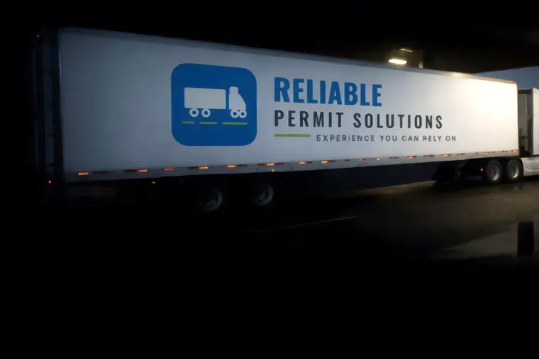 Reliable Permit Solutions truck at a fuel island