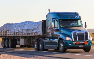 A truck carrying cargo on the road