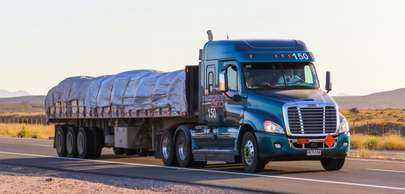 A truck carrying cargo on the road